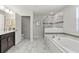 Bright bathroom featuring a soaking tub, walk-in shower, and modern fixtures at 1568 Maidstone Ct, Davenport, FL 33896