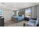 Comfortable bedroom featuring a king bed, plush bedding, and two bright windows for natural light at 1568 Maidstone Ct, Davenport, FL 33896