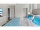 Bedroom featuring a bed and dresser with wall-mounted tv at 1568 Maidstone Ct, Davenport, FL 33896