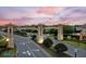 Champions Gate entrance with prominent signage and manicured landscaping creates a welcoming first impression at 1568 Maidstone Ct, Davenport, FL 33896