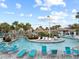 A luxurious lazy river offers a relaxing experience with tropical landscaping and comfortable lounge chairs at 1568 Maidstone Ct, Davenport, FL 33896