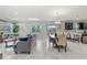 Open-concept living and dining area with tile floors and ample natural light at 1568 Maidstone Ct, Davenport, FL 33896