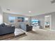 Spacious living room area with comfortable sofas and entertainment center at 1568 Maidstone Ct, Davenport, FL 33896