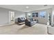 Spacious living room area with comfortable sofas and entertainment center at 1568 Maidstone Ct, Davenport, FL 33896