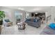 Spacious living area with tile floors, comfortable seating, and open layout at 1568 Maidstone Ct, Davenport, FL 33896