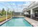Backyard pool and patio area with dining and lounge spaces at 1568 Maidstone Ct, Davenport, FL 33896