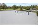A sandy volleyball court sits ready for a game in a park setting at 1568 Maidstone Ct, Davenport, FL 33896