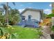 Beautiful backyard features a charming back porch and lush green grass at 515 Frank Lloyd Wright Way, Lakeland, FL 33803