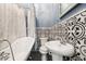 A bathroom featuring a tub and shower combination at 515 Frank Lloyd Wright Way, Lakeland, FL 33803