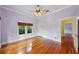 Bedroom featuring hardwood floors, a ceiling fan and plenty of natural light at 515 Frank Lloyd Wright Way, Lakeland, FL 33803