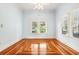 Bright bedroom with white walls, ceiling fan and decorative hardwood floor at 515 Frank Lloyd Wright Way, Lakeland, FL 33803