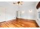 A bedroom featuring polished wood floors and a ceiling fan at 515 Frank Lloyd Wright Way, Lakeland, FL 33803