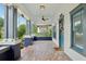 Large covered porch featuring classic columns and unique mosaic tile flooring at 515 Frank Lloyd Wright Way, Lakeland, FL 33803