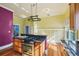 Well-equipped kitchen featuring stainless steel appliances, granite countertops, and plenty of natural light at 515 Frank Lloyd Wright Way, Lakeland, FL 33803