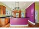 Charming kitchen with stainless steel appliances, ample counter space, and hardwood floors at 515 Frank Lloyd Wright Way, Lakeland, FL 33803