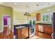 Well-equipped kitchen featuring stainless steel appliances, granite countertops, and plenty of natural light at 515 Frank Lloyd Wright Way, Lakeland, FL 33803