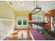 Bright kitchen featuring stainless steel appliances, granite countertops, and a large window overlooking the backyard at 515 Frank Lloyd Wright Way, Lakeland, FL 33803