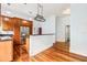 Charming kitchen featuring wood cabinets, granite countertops and an island with additional bar seating at 515 Frank Lloyd Wright Way, Lakeland, FL 33803