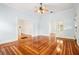 Spacious living area with beautiful hardwood floors, high ceilings, and natural light at 515 Frank Lloyd Wright Way, Lakeland, FL 33803