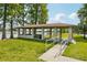 Outdoor waterfront covered picnic shelter with accessible ramp in a park setting for community gatherings at 515 Frank Lloyd Wright Way, Lakeland, FL 33803