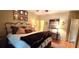 Comfortable bedroom with a large bed, decorative pillows, and unique artwork, creating a cozy and stylish retreat at 472 Blue Heron Cir, River Ranch, FL 33867