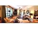 Bright living room features stone fireplace, hardwood floors, and neutral tones at 472 Blue Heron Cir, River Ranch, FL 33867