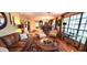 Living Room featuring hardwood floors, large windows, and an open concept floor plan at 472 Blue Heron Cir, River Ranch, FL 33867