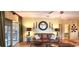 Living room features hardwood floors, natural light, and cozy seating at 472 Blue Heron Cir, River Ranch, FL 33867