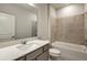 Bright bathroom featuring a bathtub, a large mirror, and a modern vanity with ample counter space at 8249 Sw 52Nd Lane Rd, Ocala, FL 34481