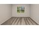 Comfortable bedroom with plush carpeting and a window that fills the room with natural light at 8249 Sw 52Nd Lane Rd, Ocala, FL 34481