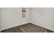 Cozy bedroom with neutral walls and soft carpeting, illuminated by natural light streaming through a window at 8249 Sw 52Nd Lane Rd, Ocala, FL 34481