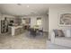 Open kitchen and dining area featuring stainless steel appliances and a center island with bar stool seating at 8249 Sw 52Nd Lane Rd, Ocala, FL 34481