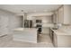 Spacious kitchen featuring stainless steel appliances, gray cabinetry and a center island at 8249 Sw 52Nd Lane Rd, Ocala, FL 34481