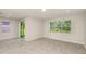 Bright living room featuring tile flooring, sliding glass door to the backyard and a large window at 8249 Sw 52Nd Lane Rd, Ocala, FL 34481