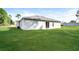 Home exterior boasts a spacious backyard with lush green grass at 143 Inconnu Ct, Kissimmee, FL 34759
