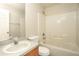 Well-lit bathroom features a shower-tub combo and a vanity at 143 Inconnu Ct, Kissimmee, FL 34759