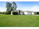 Charming single-story home with lush green lawn and attached two car garage at 143 Inconnu Ct, Kissimmee, FL 34759