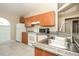 The kitchen features updated appliances and eat-in counter at 143 Inconnu Ct, Kissimmee, FL 34759