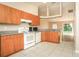 The kitchen features updated appliances and eat-in counter at 143 Inconnu Ct, Kissimmee, FL 34759