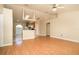 The living room features vaulted ceilings and stylish laminate flooring at 143 Inconnu Ct, Kissimmee, FL 34759