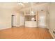 The living room features vaulted ceilings and stylish laminate flooring at 143 Inconnu Ct, Kissimmee, FL 34759