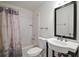 Bathroom featuring a modern vanity sink, bathtub, and shower combination at 2249 Cypress Cove Dr # E3, Tavares, FL 32778