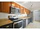 Updated kitchen featuring stainless steel appliances and modern cabinetry at 2249 Cypress Cove Dr # E3, Tavares, FL 32778
