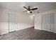 A spacious living room with tile flooring and a ceiling fan is well-lit and inviting at 2249 Cypress Cove Dr # E3, Tavares, FL 32778