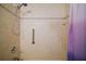 A tiled shower featuring safety grab bars and a shower curtain at 2249 Cypress Cove Dr # E3, Tavares, FL 32778