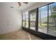 Bright sunroom with multiple windows offering natural light and garden views at 2249 Cypress Cove Dr # E3, Tavares, FL 32778