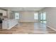 Open-concept layout featuring a kitchen with an island and barstool seating at 5408 Sw 85Th Avenue Rd, Ocala, FL 34481