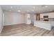 Open-concept kitchen and living room featuring recessed lighting and modern finishes at 5408 Sw 85Th Avenue Rd, Ocala, FL 34481