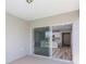 Sliding glass doors open to the patio, with a view to the bright kitchen at 5408 Sw 85Th Avenue Rd, Ocala, FL 34481