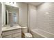 Clean bathroom with white subway tile, neutral walls, a vanity, and a combined tub and shower at 5433 Sw 82Nd Ter, Ocala, FL 34481